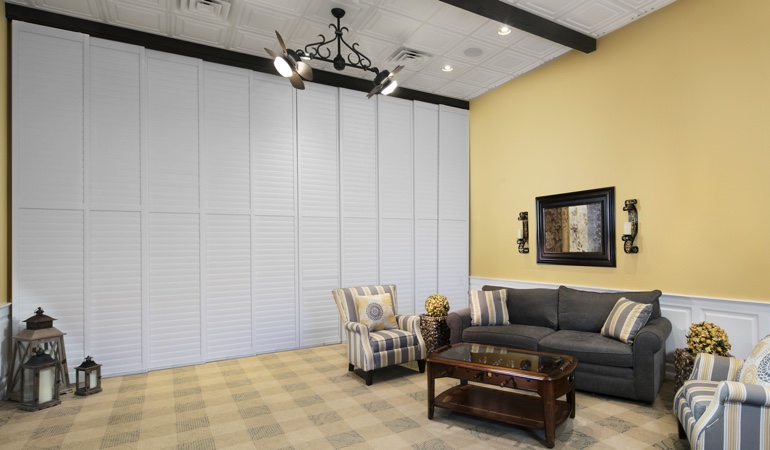 Interior shutters as a room divider for a business
